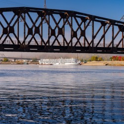 River cruise boat docked in Dubuque IA under Railroad bridge