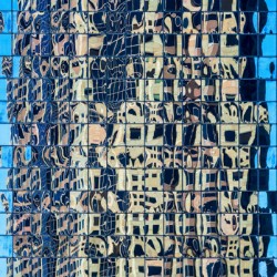Complex reflections of a modern skyscraper in St Louis 