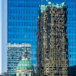 Complex reflections of a modern skyscraper in St Louis office bu