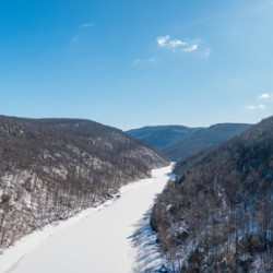 Aerial view up the frozen Cheat River in Morgantown WV