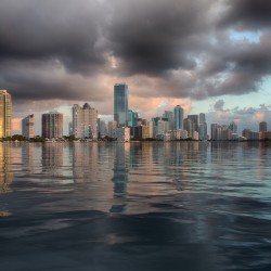 Dawn view of Miami Skyline reflected in water