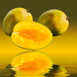 Two mangoes and one cut mango reflecting