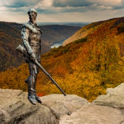 Mountaineer statue from WVU with fall leaves in West Virginia