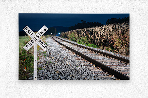 Oncoming train with railroad crossing sign  Metal print