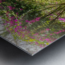 A vintage wooden rocking chair with a straw hat rests on a porch Metal print