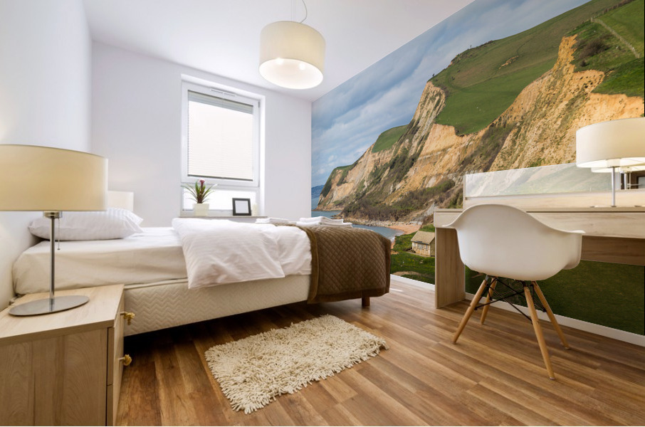 Cottage by cliffs at West Bay Dorset in UK Mural print