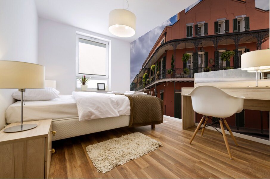 Traditional wrought iron balcony on ochre New Orleans house Mural print