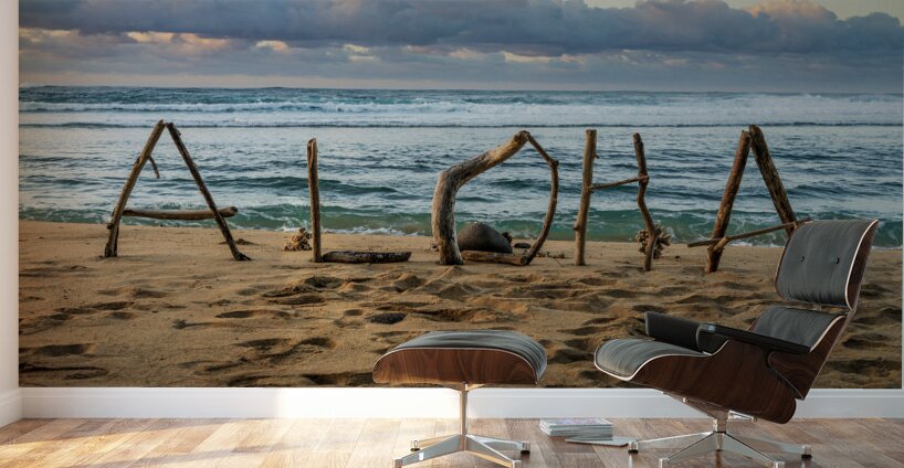 A driftwood greeting spells out a warm welcome with Aloha Kauai Wall Murals