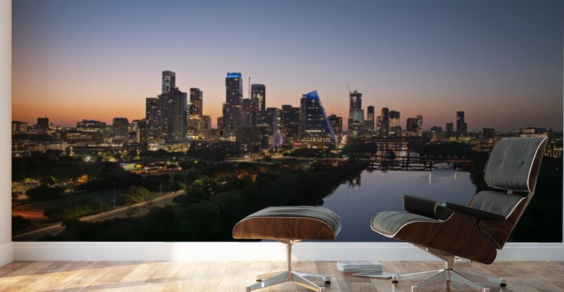 Orange skies behind skyline of Austin Texas as sun starts to ris Wall Murals