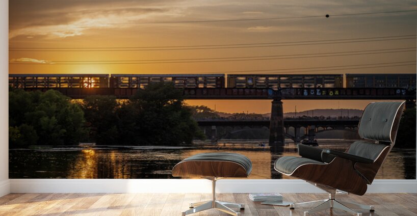 Freight train on the railroad bridge in Austin at sunset Wall Murals