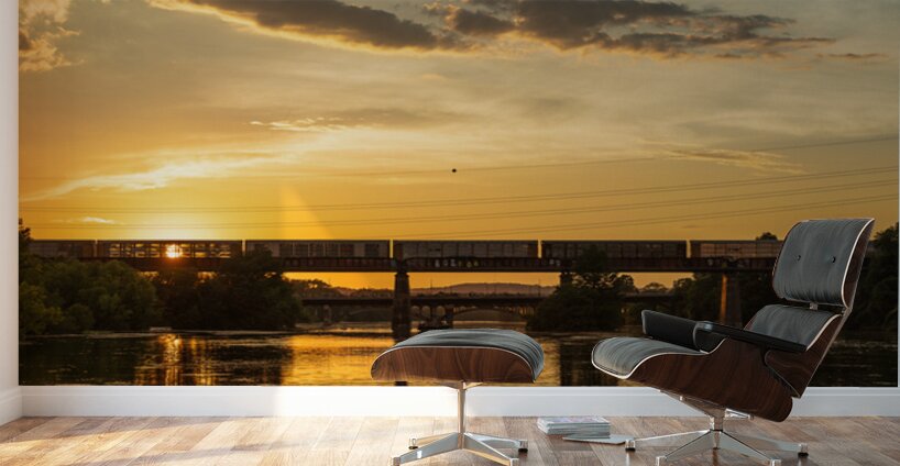 Freight train on the railroad bridge in Austin at sunset Wall Murals