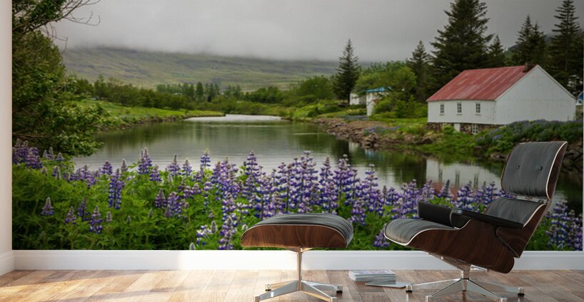 Peaceful scene in Seydisfjordur of river flowing from misty moun Wall Murals