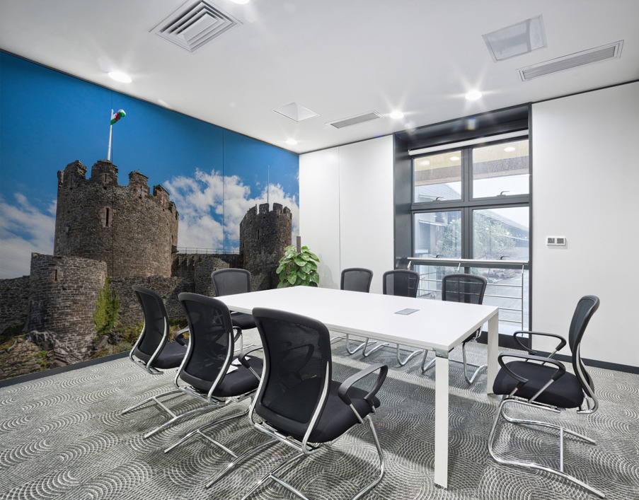 Flag flies over the historic Conwy castle in North Wales Wall Printing