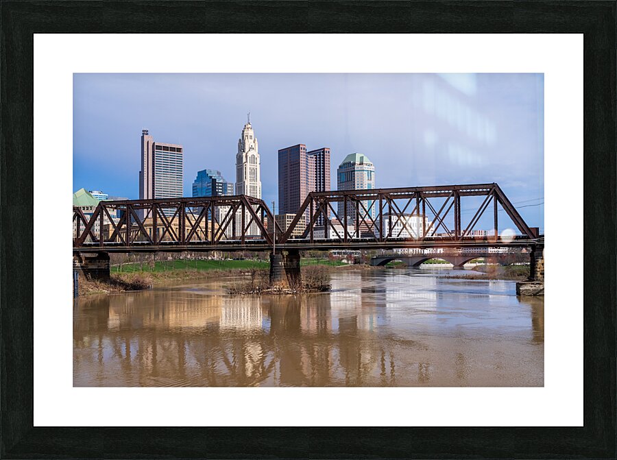 Columbus Ohio waterfront skyline behind railroad truss bridge Picture Frame print