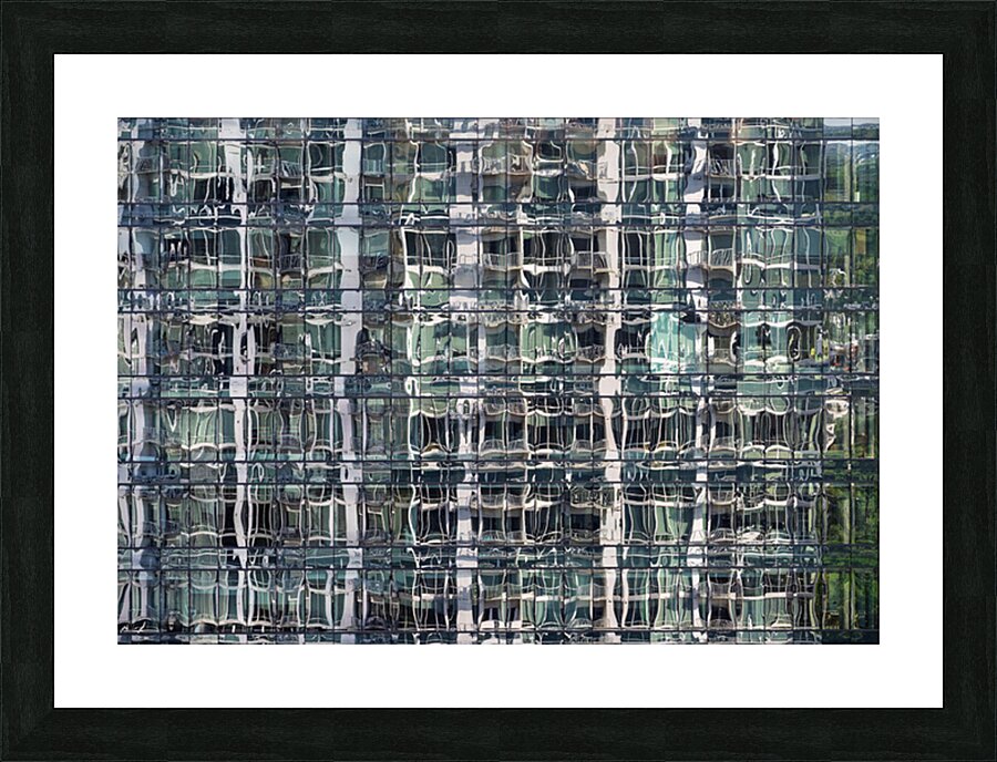 Reflections of condominium tower in windows of apartment buildin Picture Frame print