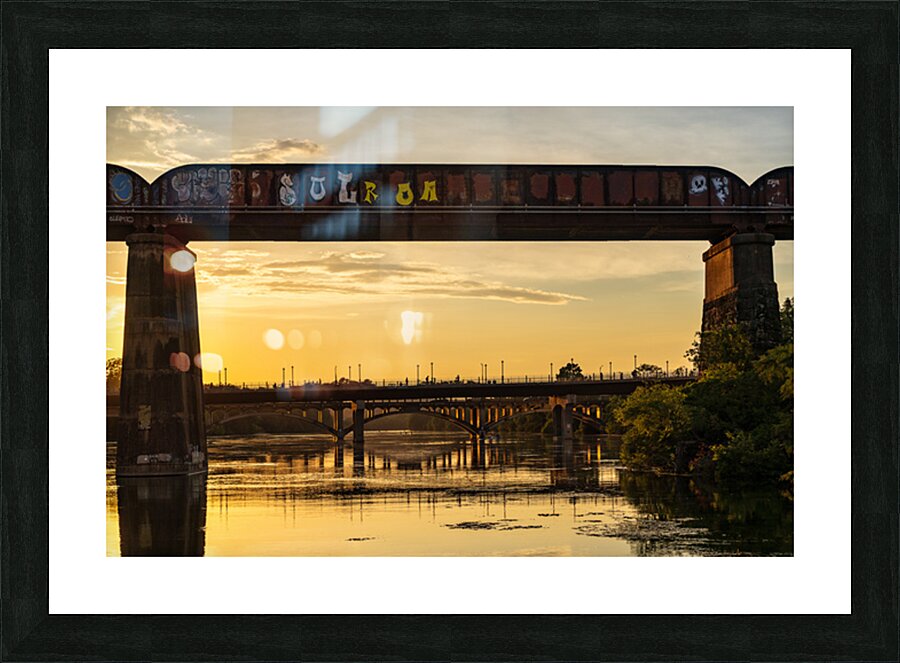 Bridges behind the railroad bridge in Austin at sunset Picture Frame print