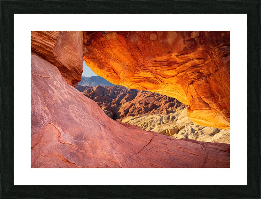 Natural arch on Atlatl Rock with scenic backgound added Picture Frame print