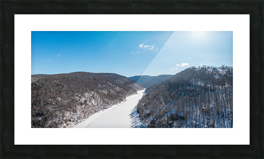 Aerial view up the frozen Cheat River in Morgantown WV  Framed Print Print