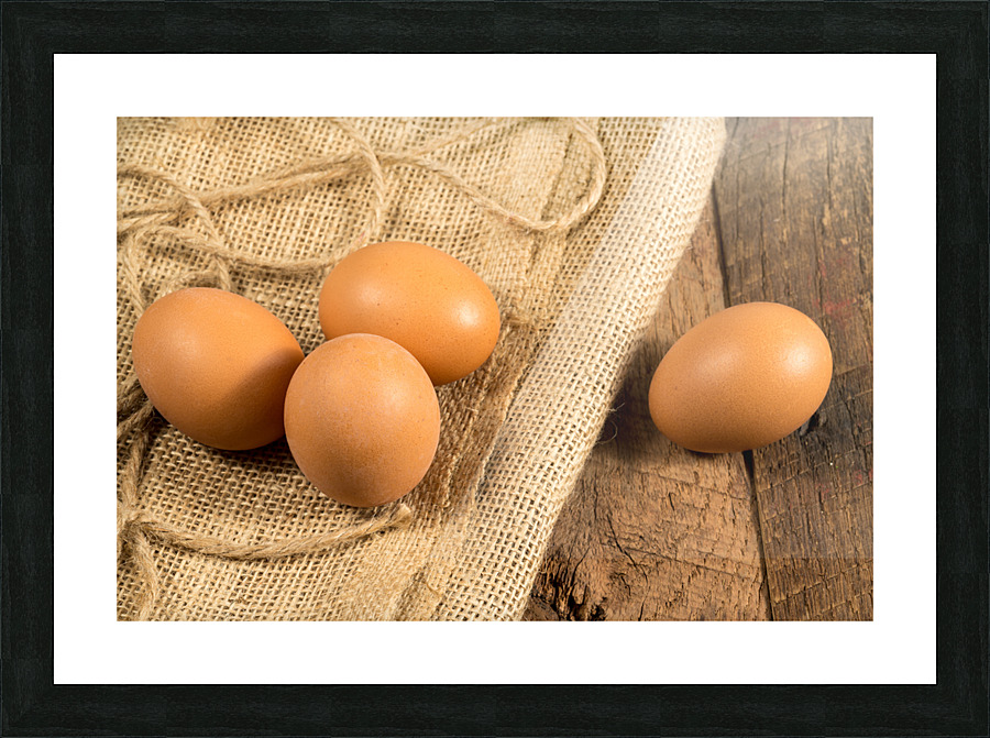 Freshly laid organic eggs on wooden bench Picture Frame print