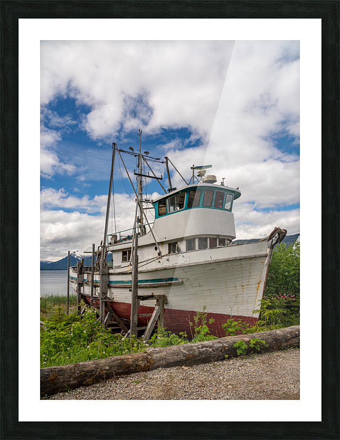 Historic but rotting fishing boat by ocean at Icy Strait Point  Framed Print Print