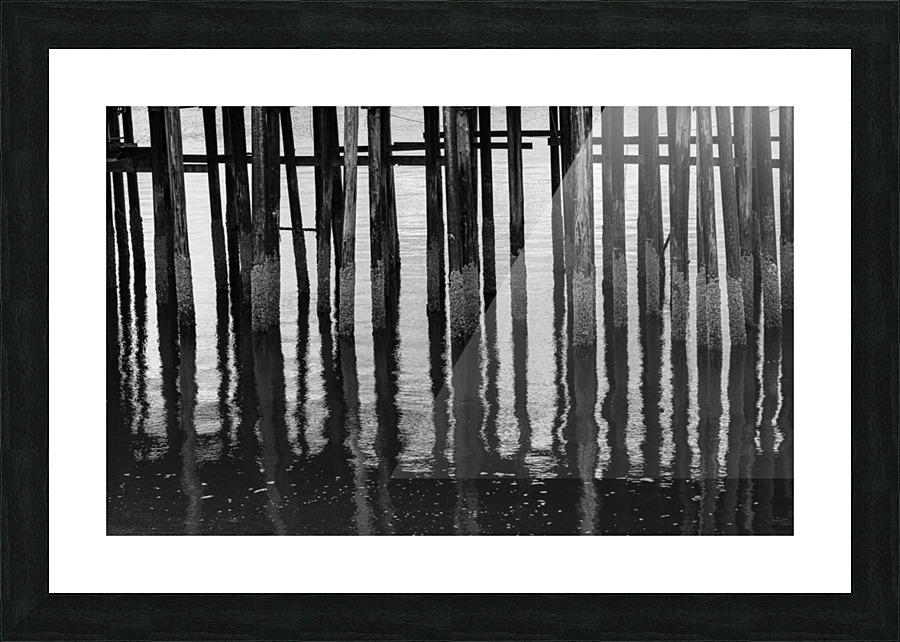 Black and whited wooden pier structure at Icy Strait Point Picture Frame print