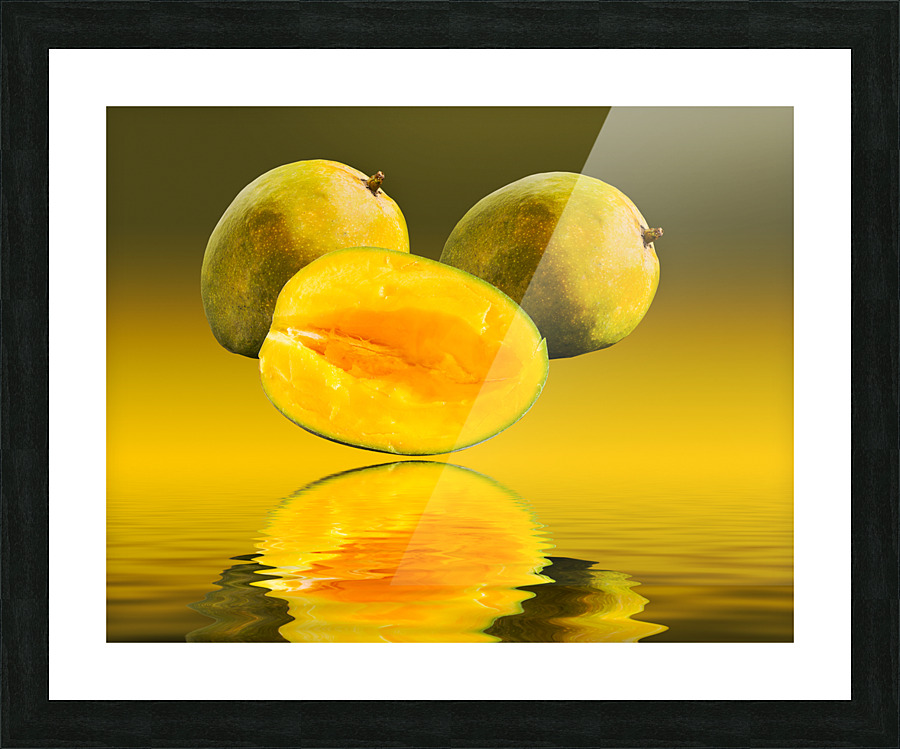 Two mangoes and one cut mango reflecting  Impression encadrée