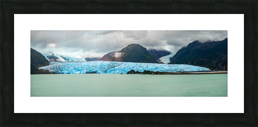Amalia Glacier towers over large rocks and trees in Patagonia  Framed Print Print