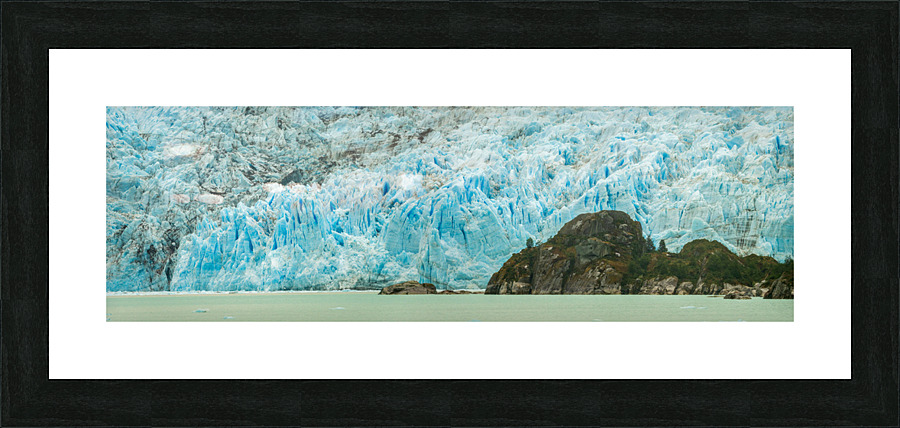 Amalia Glacier towers over large rocks and trees in Patagonia  Framed Print Print