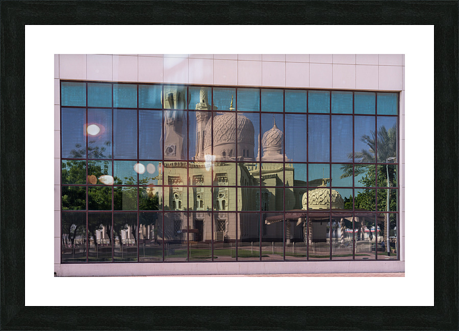 Reflection of the Jumeirah Mosque in Dubai in the windows of an   Framed Print Print