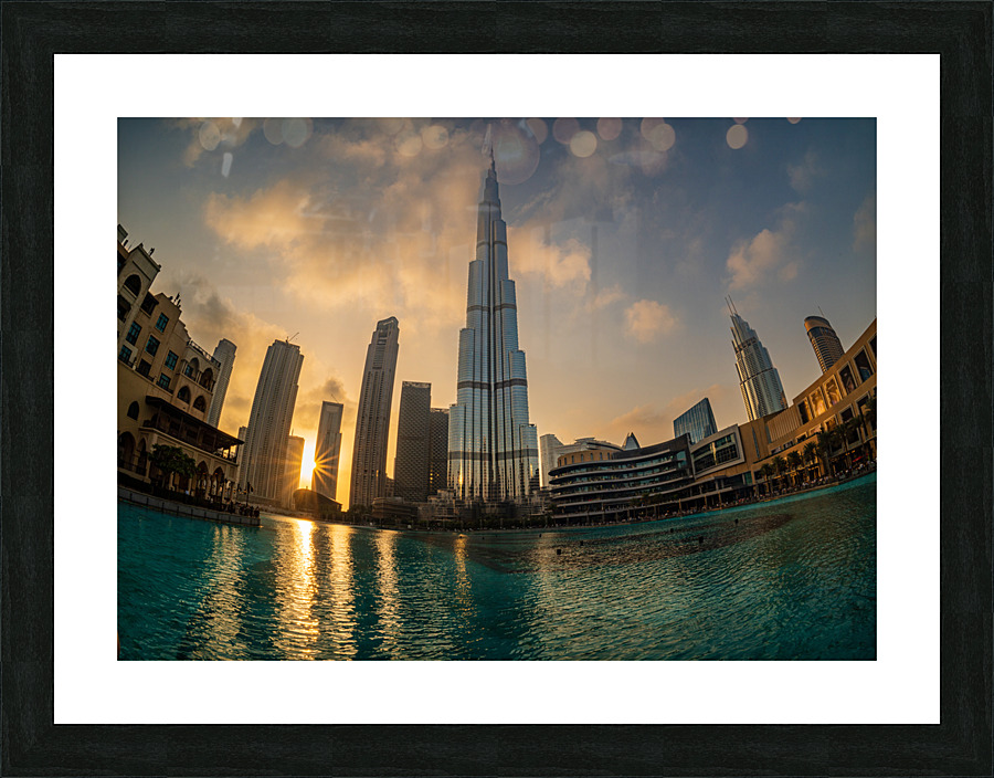 Sunset over the towers of Dubai downtown business district  Framed Print Print