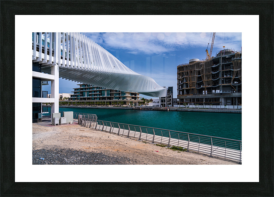 Dubai Water Canal bridge twists towards new apartment blocks  Framed Print Print