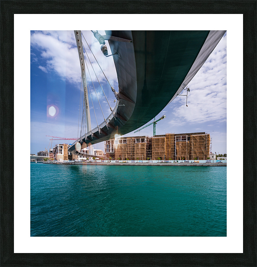 Modern apartments alongside Dubai Canal under Tolerance bridge Picture Frame print