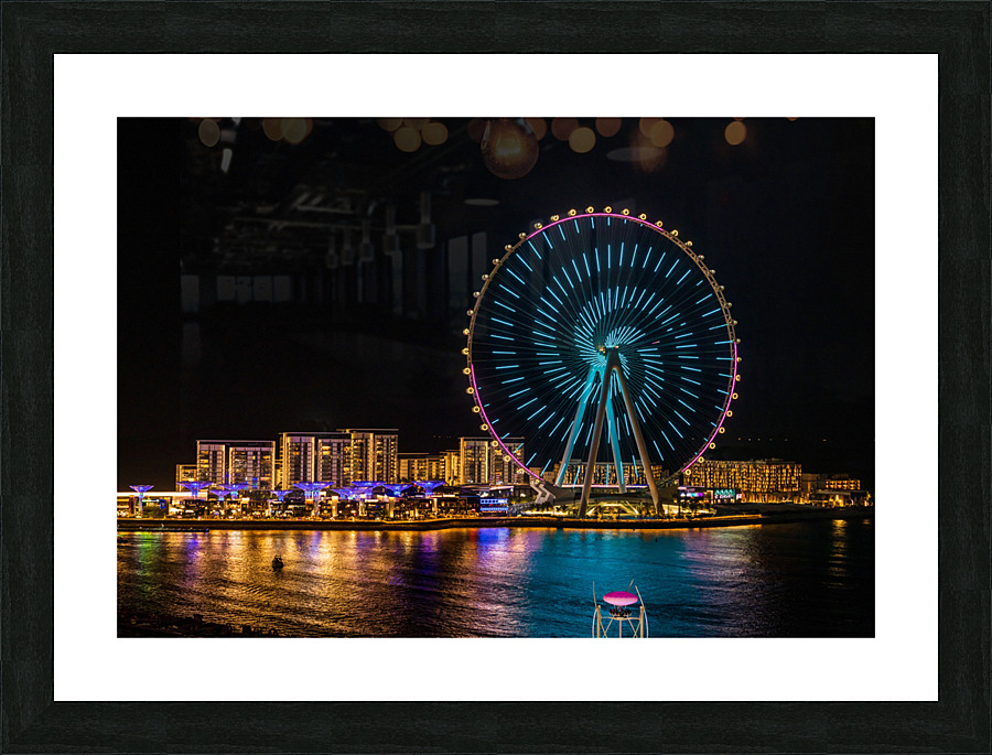 Light show on Ain Dubai observation wheel at sunset  Framed Print Print