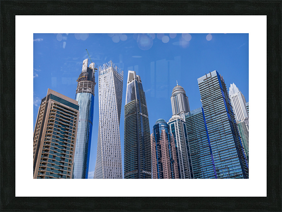 Cayan Tower among tall buildings on waterfront at Dubai Marina  Impression encadrée