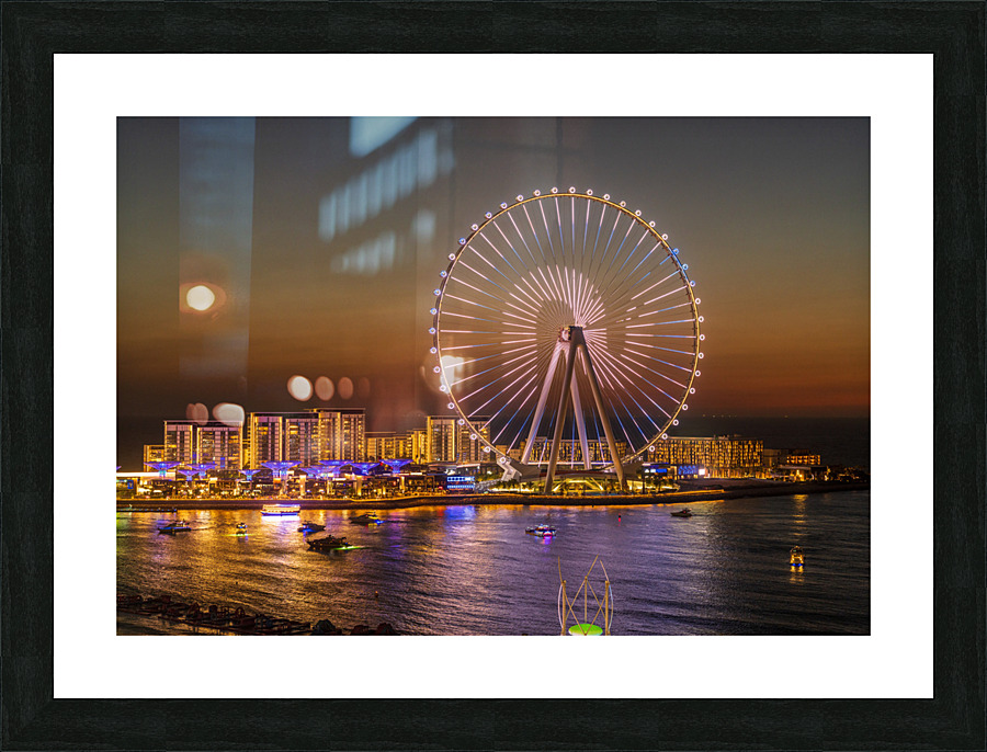 Light show on Ain Dubai observation wheel at sunset  Framed Print Print
