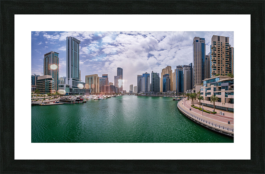 Modern buildings crowd the waterfront at Dubai Marina UAE  Framed Print Print