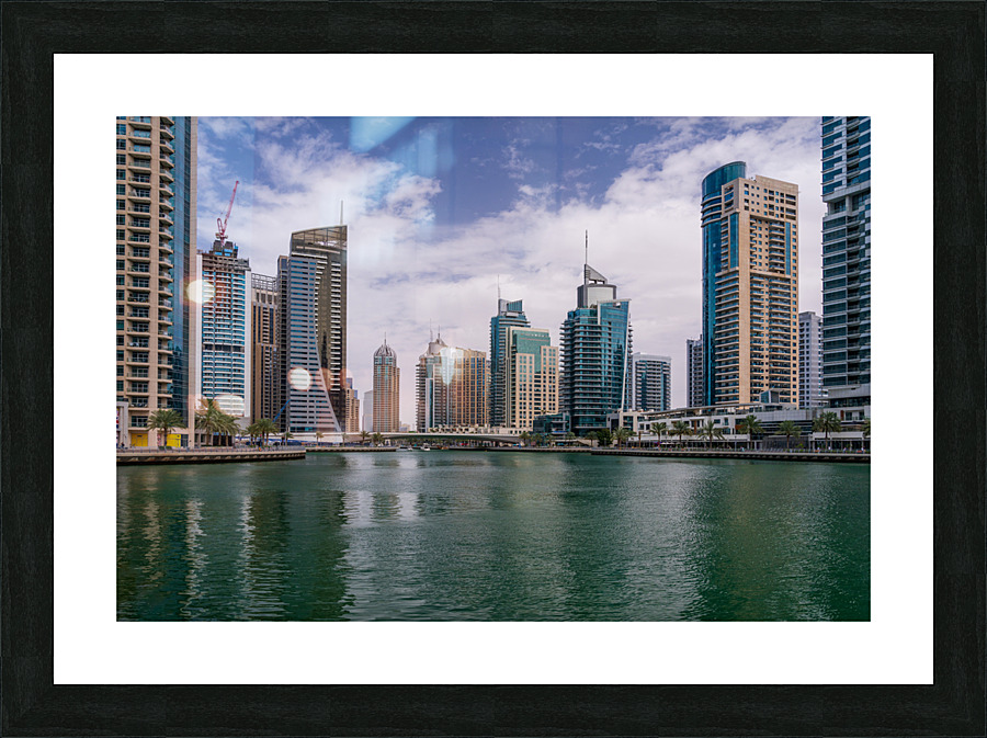 Modern buildings crowd the waterfront at Dubai Marina UAE  Impression encadrée