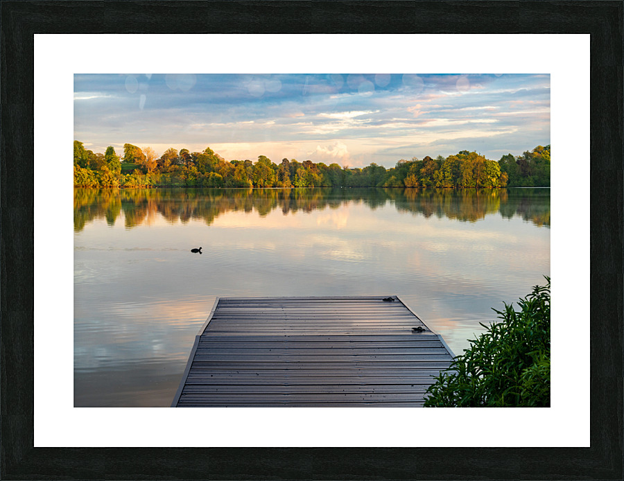View across the Ellesmere Mere to a clear reflection of distant   Framed Print Print