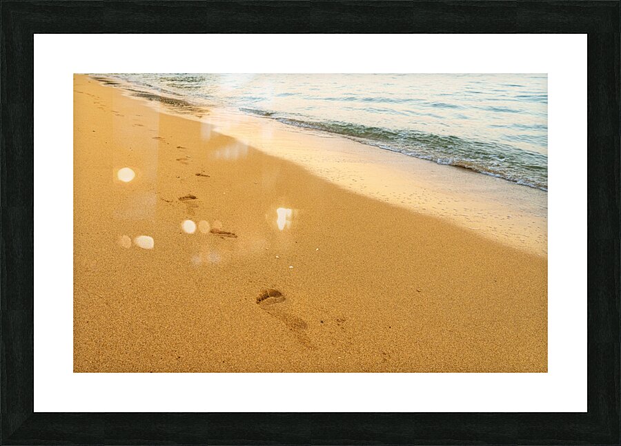 Early morning footsteps on Tunnels Beach on Kauai in Hawaii  Framed Print Print
