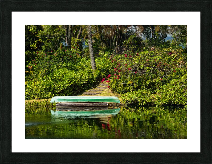 Green canoe on dock reflecting into calm lake or pond in garden  Framed Print Print