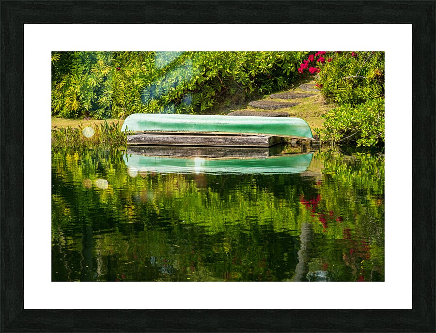 Green canoe on dock reflecting into calm lake or pond in garden  Impression encadrée