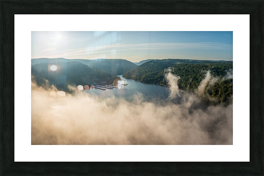 Mist rises from Cheat Lake in the early morning as the sun rises  Framed Print Print