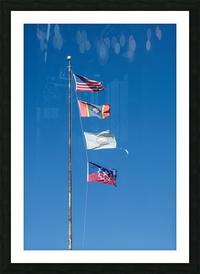 Flagpole with multiple flags in the small town of Greenville MS  Framed Print Print