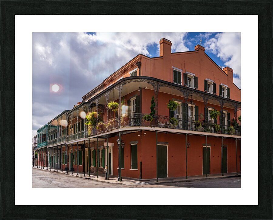 Traditional wrought iron balcony on ochre New Orleans house  Framed Print Print