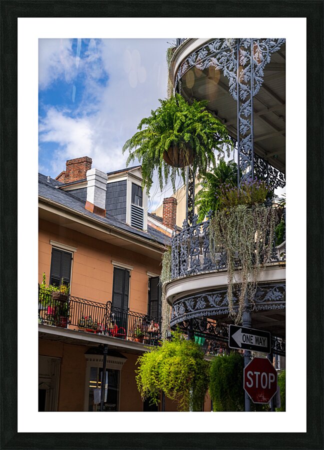 Traditional wrought iron balcony on brick New Orleans house  Framed Print Print