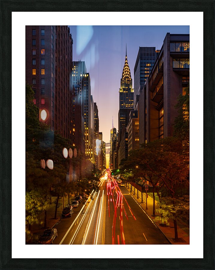 Manhattanhenge when the sun sets along 42nd street in NY  Framed Print Print