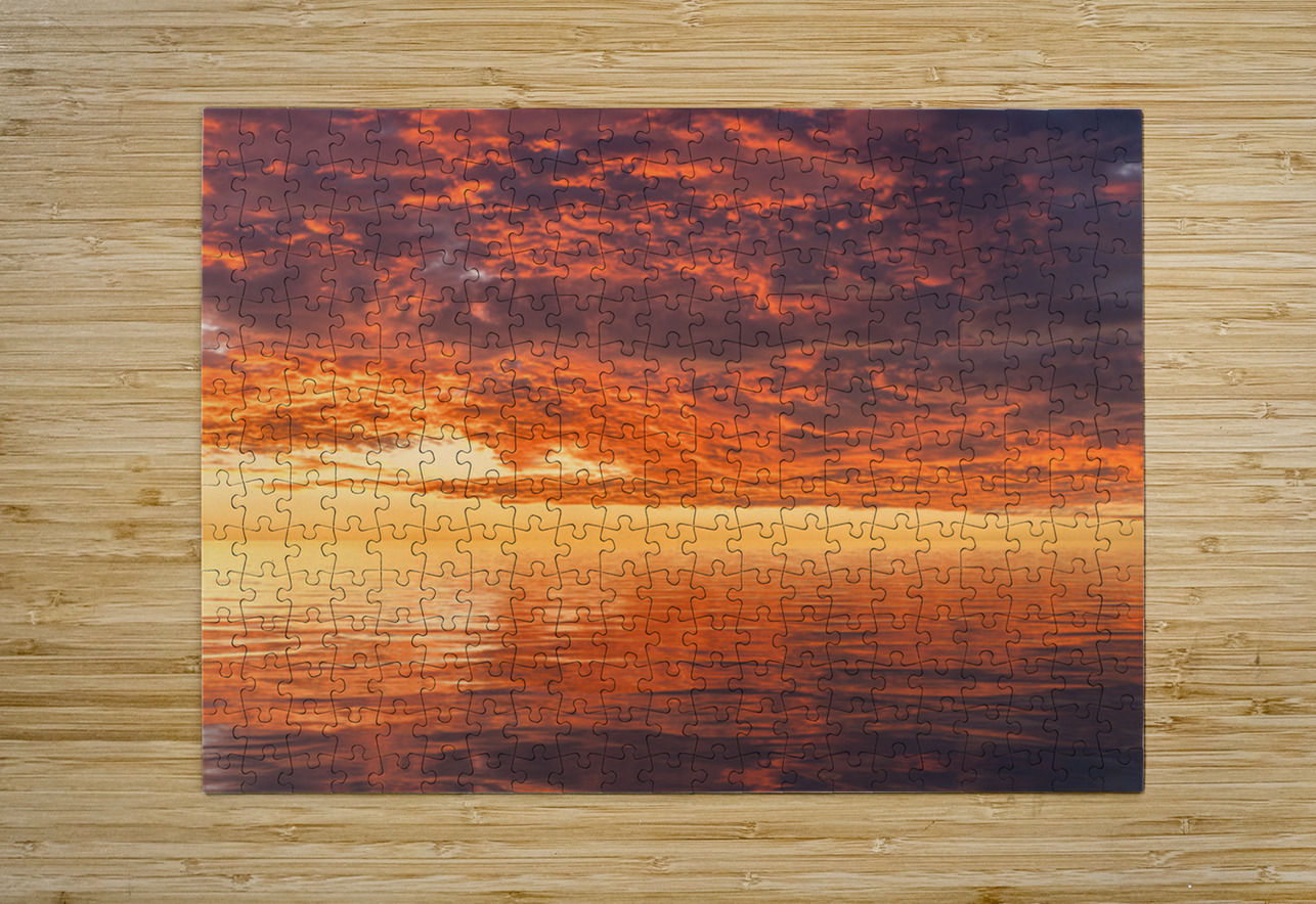 Dramatic sunset reflected in the smooth ripples of a lake or oce Steve Heap Puzzle printing