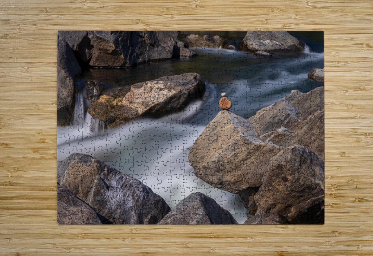 Pebbles balanced on rocks in raging river illustrating resilienc Steve Heap Puzzle printing