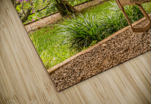 A vintage wooden rocking chair with a straw hat rests on a porch Steve Heap puzzle