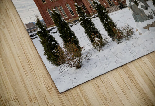 Mountaineer statue against Woodburn Hall Steve Heap puzzle
